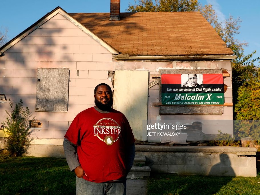 Aaron Sims standing in front of former Malcolm X house
